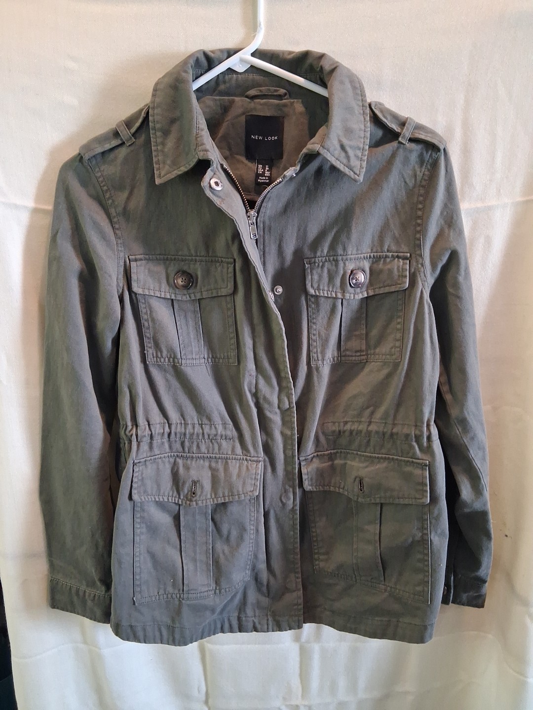 This is a lady’s army green Miller style utility jacket made by new look